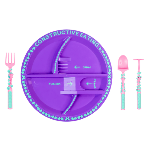 Purple kids plate with pink and teal flower-themed fork, spoon, and pusher utensils from Constructive Eating.